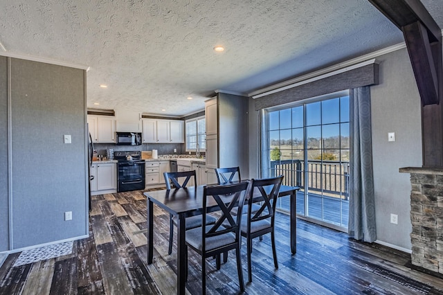 dining space featuring baseboards, dark wood finished floors, ornamental molding, a textured ceiling, and recessed lighting