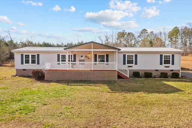 view of front of house with crawl space, a porch, metal roof, and a front yard