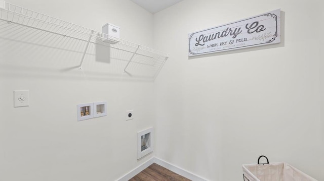 clothes washing area with laundry area, washer hookup, electric dryer hookup, and baseboards