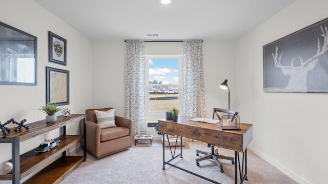 office space featuring carpet, visible vents, and baseboards