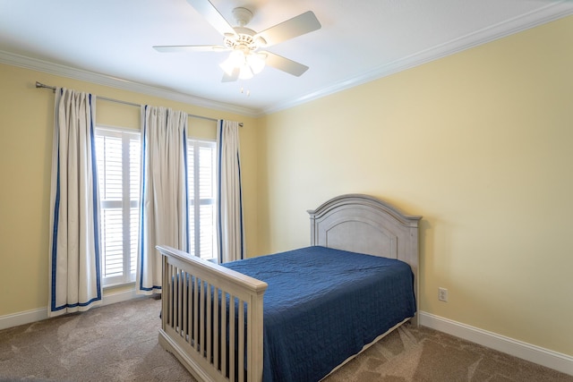 bedroom with ceiling fan, baseboards, crown molding, and carpet