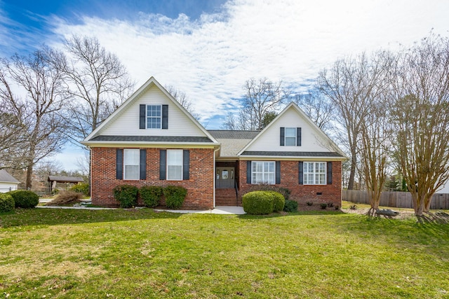 view of front facade featuring crawl space, a front lawn, brick siding, and fence