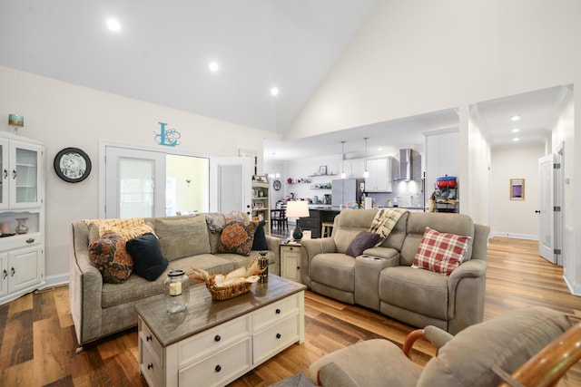 living room featuring baseboards, high vaulted ceiling, dark wood-type flooring, and recessed lighting