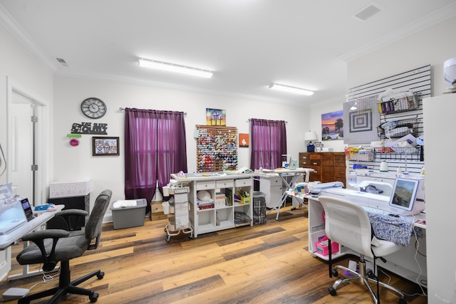 office area featuring ornamental molding, wood finished floors, and visible vents