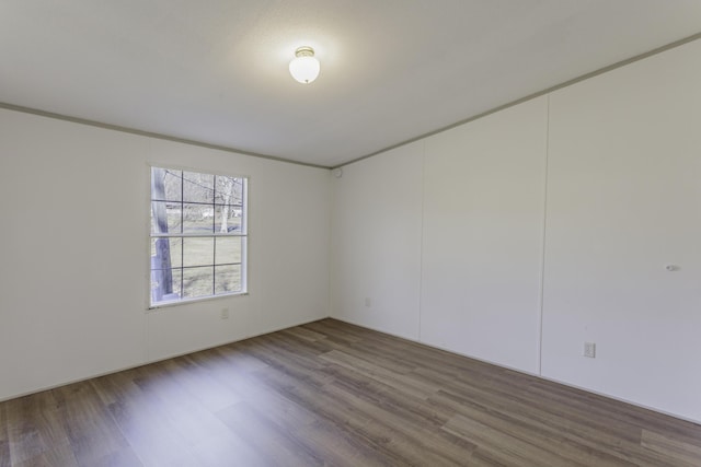 unfurnished room with wood finished floors