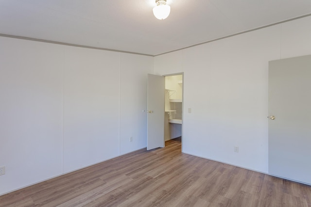 empty room with wood finished floors