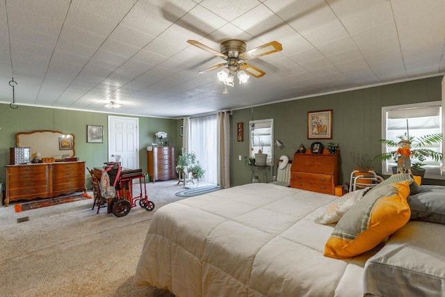 carpeted bedroom with a ceiling fan