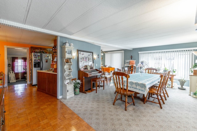 dining space featuring a textured ceiling