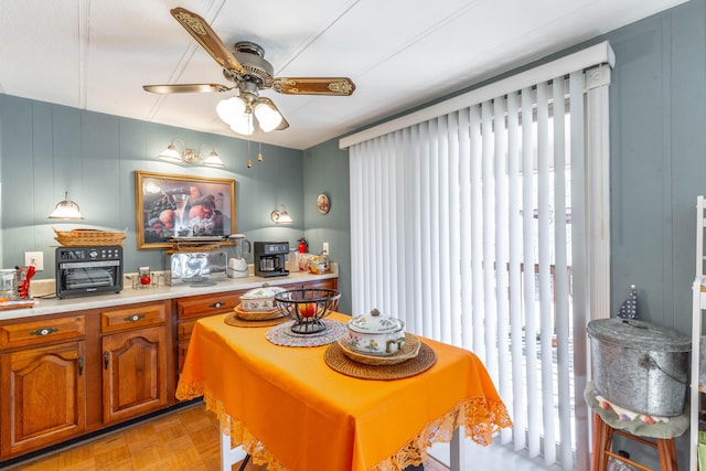 dining space with a ceiling fan