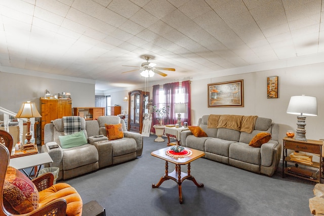 carpeted living room with ceiling fan