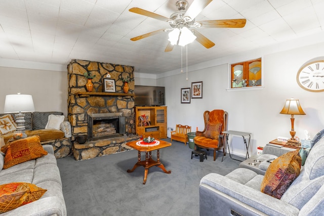 living area featuring carpet floors, a fireplace, and ceiling fan