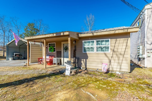 view of front of home featuring a detached carport and metal roof