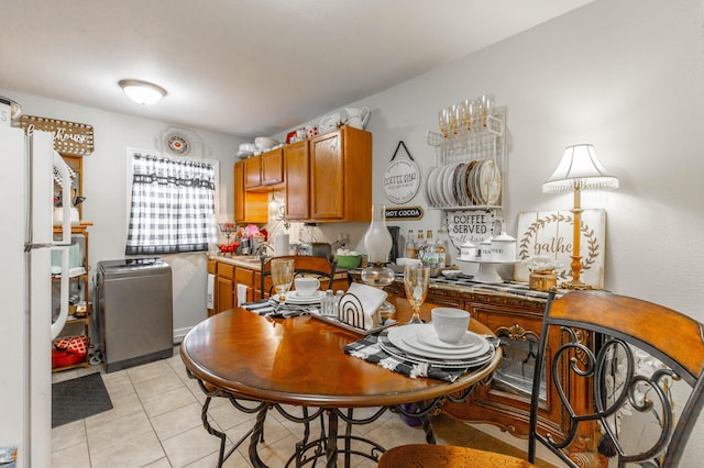 dining space featuring light tile patterned floors