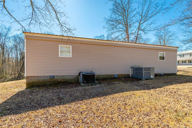 view of home's exterior with central AC unit