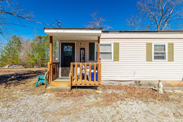 view of front facade featuring covered porch and crawl space