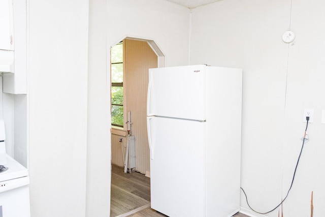 kitchen featuring white appliances and light wood-style floors