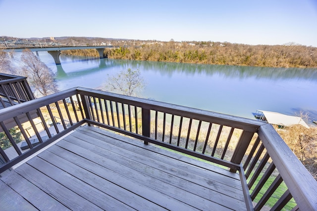 wooden deck featuring a water view