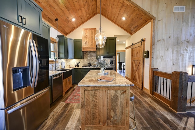 kitchen with appliances with stainless steel finishes, wooden ceiling, green cabinets, and a barn door