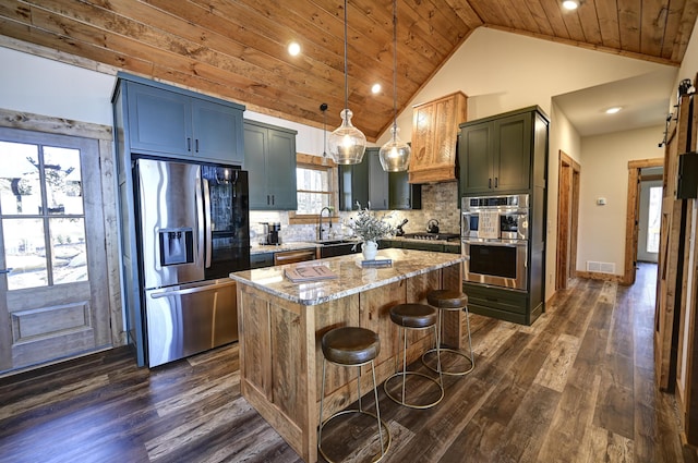 kitchen featuring light stone counters, stainless steel appliances, a kitchen island, wood ceiling, and visible vents