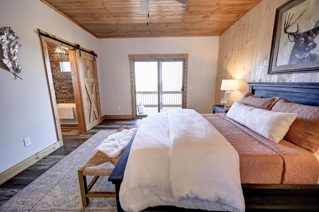 bedroom with ensuite bathroom, a barn door, wooden ceiling, wood finished floors, and access to exterior