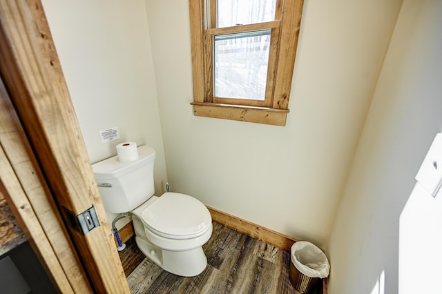 bathroom featuring toilet and wood finished floors