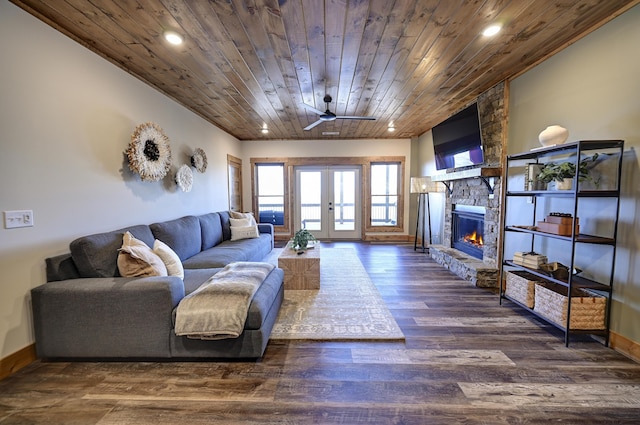 living room featuring french doors, a fireplace, recessed lighting, wood ceiling, and wood finished floors