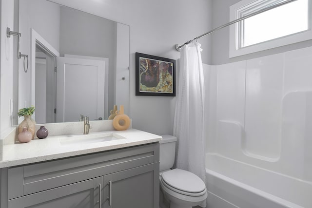 bathroom with shower / tub combo, vanity, and toilet