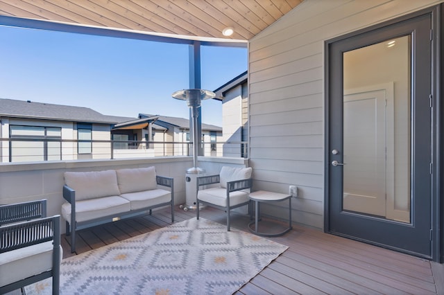 wooden terrace featuring outdoor lounge area