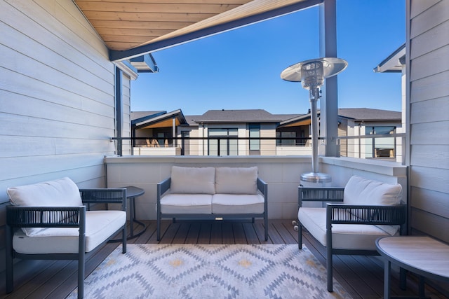 wooden terrace featuring outdoor lounge area