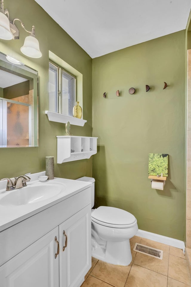 full bathroom featuring toilet, baseboards, visible vents, and tile patterned floors