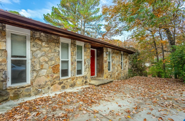 exterior space with stone siding