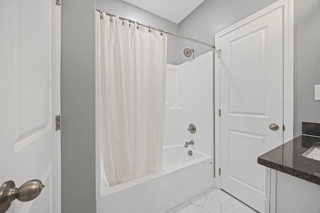 full bath featuring shower / bath combo and marble finish floor