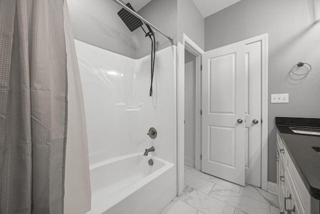 bathroom with baseboards, shower / tub combo with curtain, marble finish floor, and vanity