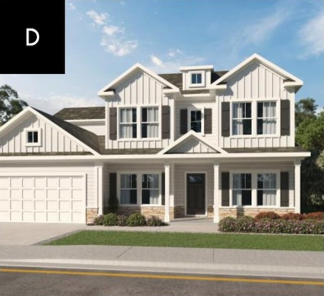 view of front of property featuring stone siding, board and batten siding, concrete driveway, and an attached garage