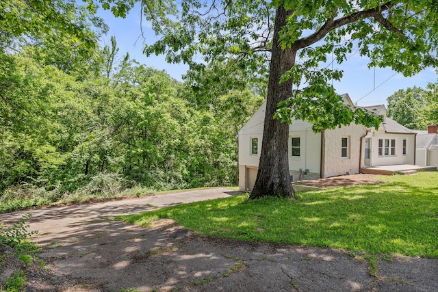 exterior space with an attached garage and concrete driveway