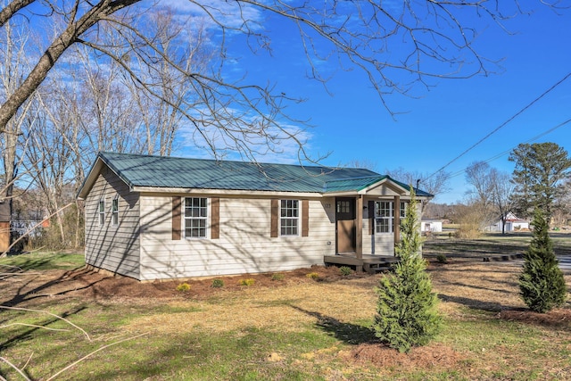 view of front of house featuring metal roof