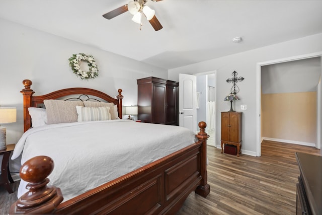 bedroom with dark wood-style flooring, ceiling fan, and baseboards