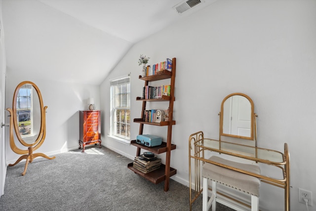 living area featuring vaulted ceiling, carpet floors, visible vents, and baseboards