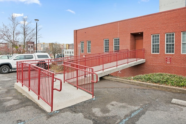 view of community featuring uncovered parking