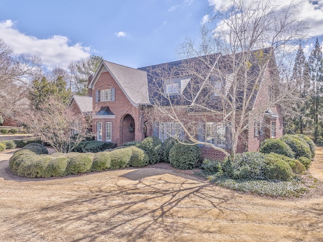 tudor home with brick siding