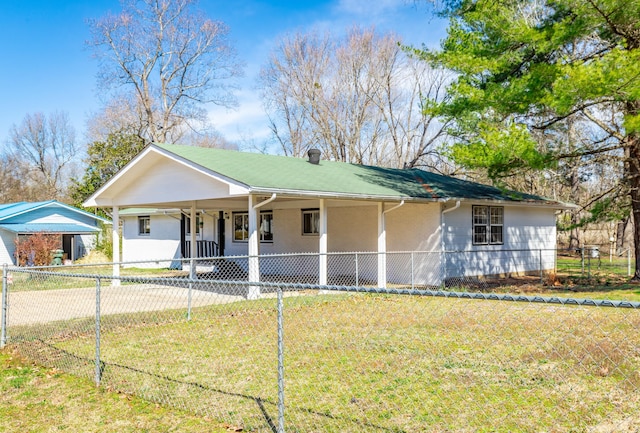 view of front of home featuring driveway, a front lawn, a fenced front yard, a carport, and a chimney