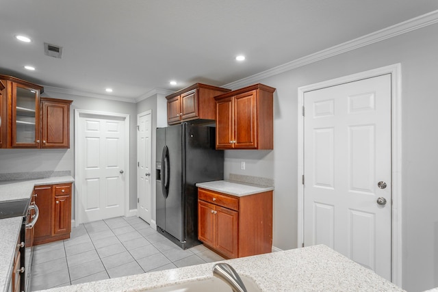 kitchen with electric range, visible vents, ornamental molding, black fridge with ice dispenser, and recessed lighting