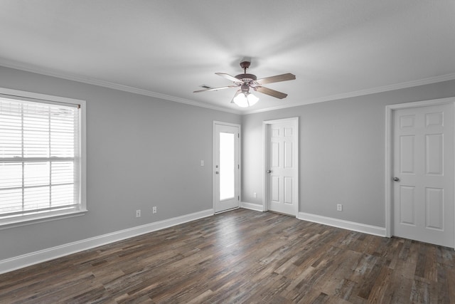 unfurnished room with crown molding, dark wood-style floors, baseboards, and ceiling fan