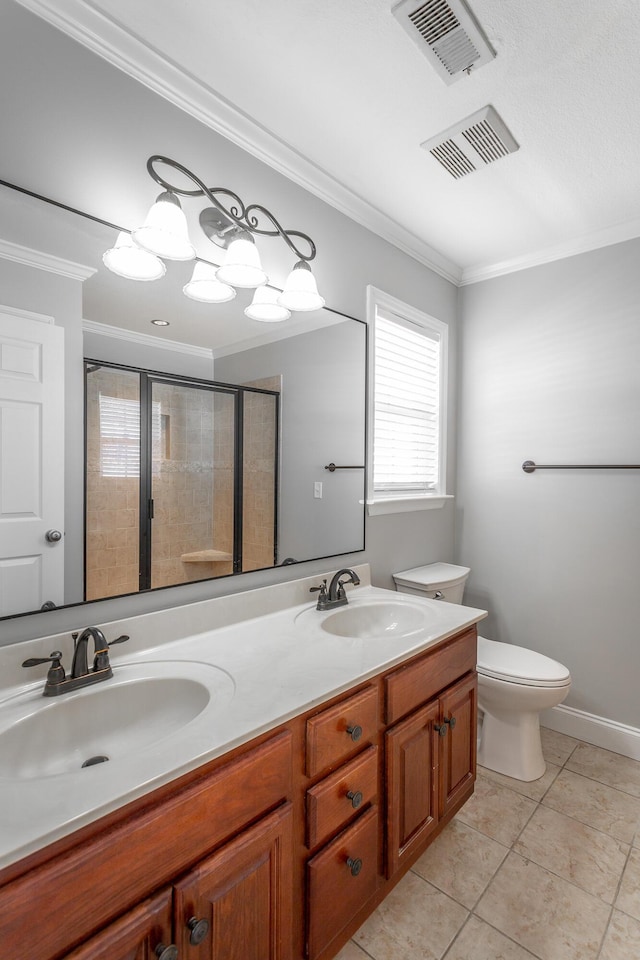 bathroom with toilet, ornamental molding, and a sink