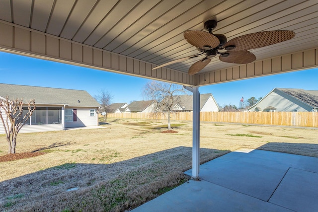 view of patio / terrace featuring ceiling fan and fence