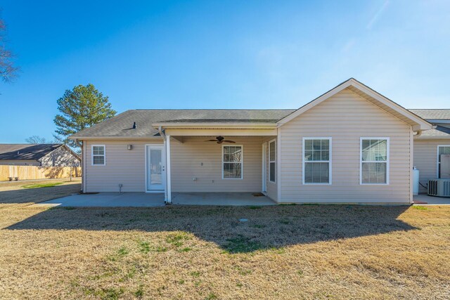 rear view of property with a patio area, central AC unit, a lawn, and ceiling fan