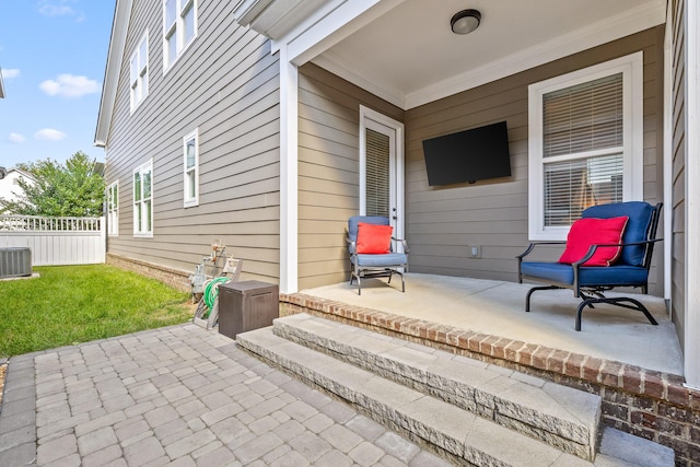 view of patio with fence and cooling unit