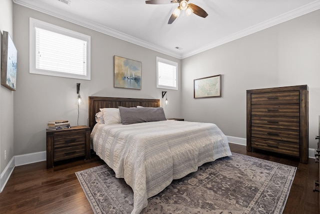 bedroom with ornamental molding, dark wood-style flooring, ceiling fan, and baseboards