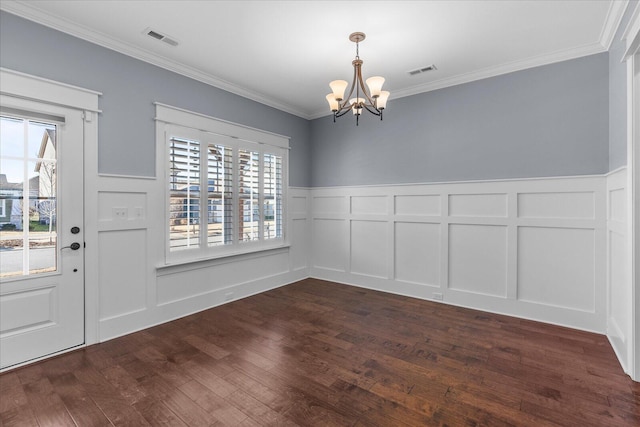 unfurnished dining area featuring visible vents, a chandelier, dark wood-style flooring, and ornamental molding