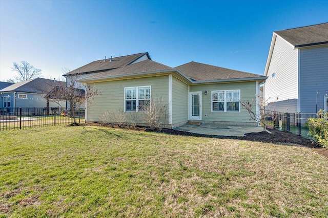 back of house with a patio area, a fenced backyard, and a lawn